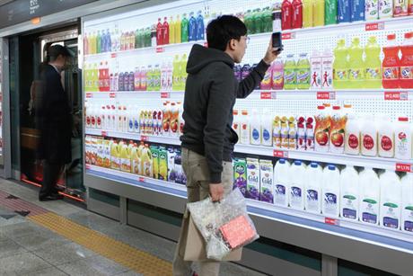 virtual supermarket shopper scanning QR codes
